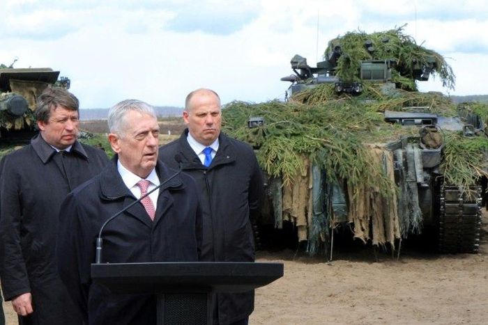 US Defense Secretary James Mattis flanked by his Lithuanian and Latvian counterparts after meeting troops in Lithuania