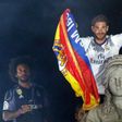 Real Madrid's captain Sergio Ramos (R) and defender Marcelo celebrate the team's La Liga title, at the Plaza de Cibeles in Madrid, on May 21, 2017