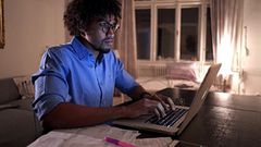 Student studying online at night (iStock)