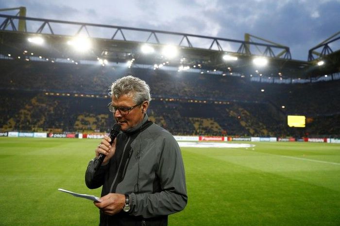 Dortmund's Norbert Dickel announces the postponement of the match after the team bus of Borussia Dortmund had some windows broken by an explosion prior to the UEFA Champions League match BVB Borussia Dortmund v Monaco on April 11, 2017