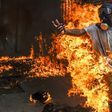 A demonstrator catches fire during clashes in a Caracas protest