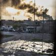 Smoke billows from Islamic State positions as a convoy from the Iraqi Special Forces 2nd division move into position during fighting in the eastern Samah area of Mosul