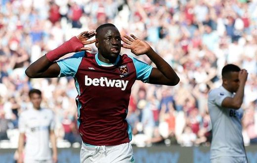 West Ham United's Cheikhou Kouyate celebrates scoring the opening goal against Swansea City at The London Stadium, in east London on April 8, 2017