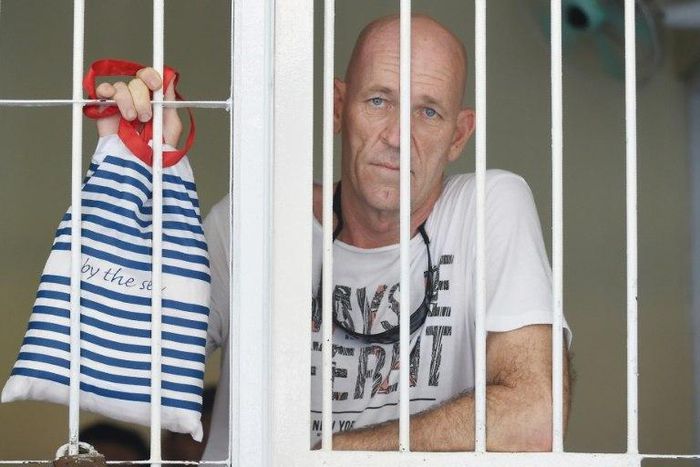David Fox, a British former war correspondent, waits in a holding cell in Denpasar on Indonesia's resort island of Bali on March 9, 2017 before his trial for using hashish
