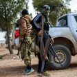 Two fighters from the Free Syrian Army stand guard on February 4, 2017 near the town of Bizaah northeast of the city of Al-Bab where Islamic State is reportedly 'besieged'