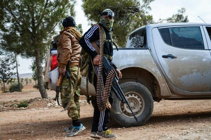 Two fighters from the Free Syrian Army stand guard on February 4, 2017 near the town of Bizaah northeast of the city of Al-Bab where Islamic State is reportedly 'besieged'
