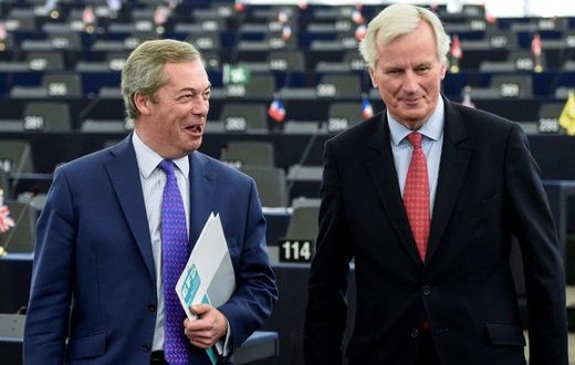 Brexit champion Nigel Farage shares a joke with Brexit negotiator Michel Barnier