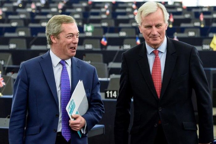 Brexit champion Nigel Farage shares a joke with Brexit negotiator Michel Barnier