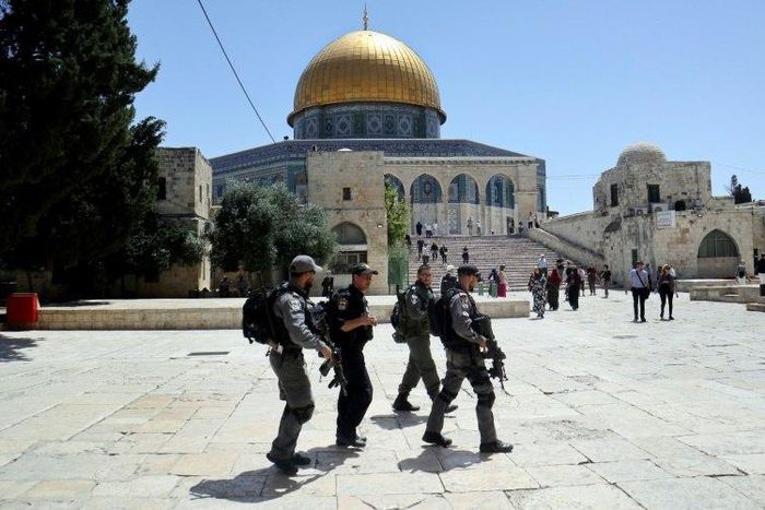 Israeli police walk past the Dome of the Rock in the compound known to Muslims as the Haram al-Sharif and to Jews as Temple Mount on May 16, 2017