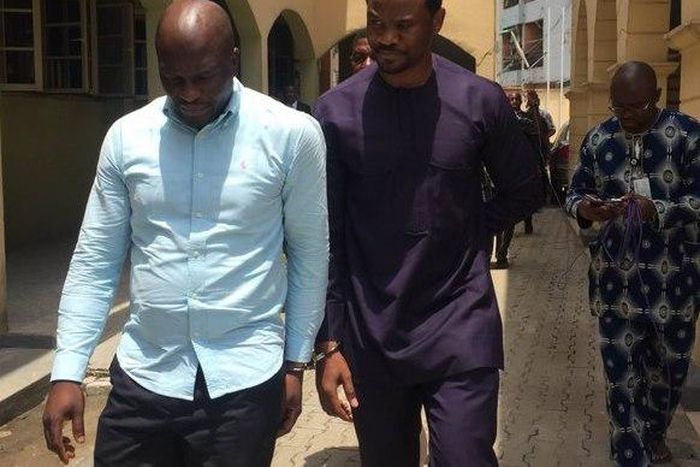 Lekki Gardens MD, Richard Nyong (right) and contractor arrive an Ebute-Meta Magistrate Court in handcuffs on Friday, March 11.