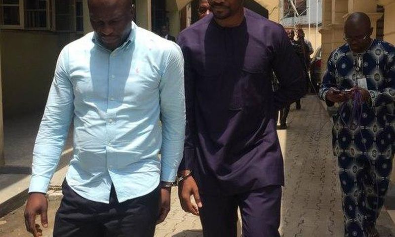 Lekki Gardens MD, Richard Nyong (right) and contractor arrive an Ebute-Meta Magistrate Court in handcuffs on Friday, March 11.