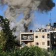 Smoke rises after reported opposition fire from buildings in an eastern government-held neighbourhood of the northern Syrian city of Aleppo on October 20, 2016