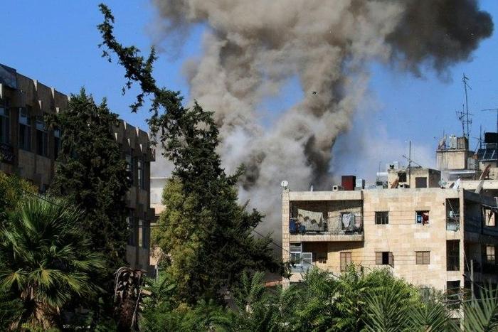 Smoke rises from reported opposition fire from buildings in an eastern government-held neighbourhood of the northern Syrian city of Aleppo, on October 20, 2016