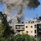 Smoke rises from reported opposition fire from buildings in an eastern government-held neighbourhood of the northern Syrian city of Aleppo, on October 20, 2016