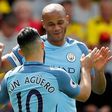 Manchester City's defender Vincent Kompany (R) celebrates scoring against Watford with striker Sergio Aguero on May 21, 2017