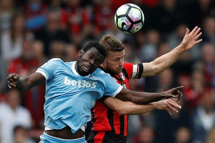 Stoke City's Mame Biram Diouf (L) vies with Bournemouth's Simon Francis during their English Premier League football match at the Vitality Stadium in Bournemouth, southern England on May 6, 2017