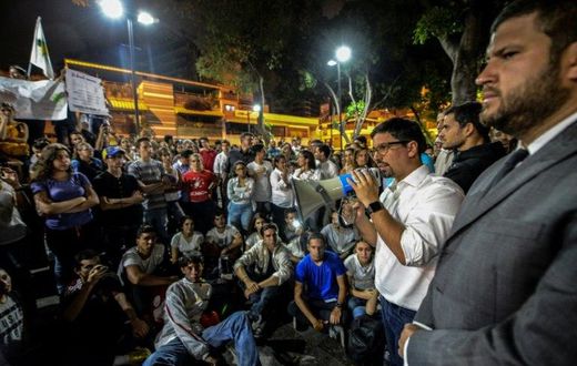 The first vice president of Venezuela's National Assembly, Freddy Guevara addresses marchers paying tribute to student Juan Pablo Pernalete, killed on April 26 by the impact of a gas grenade during a protest, in Caracas, on April 29, 2017