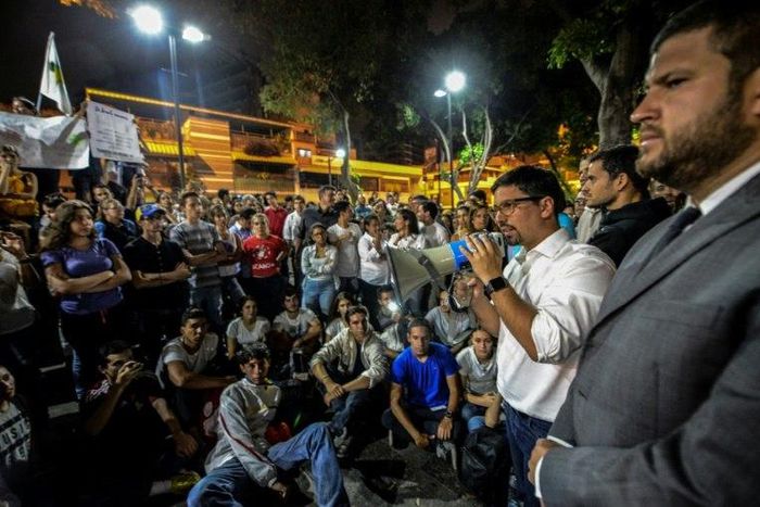 The first vice president of Venezuela's National Assembly, Freddy Guevara addresses marchers paying tribute to student Juan Pablo Pernalete, killed on April 26 by the impact of a gas grenade during a protest, in Caracas, on April 29, 2017