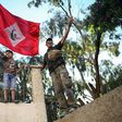 A Moroccan boy holds a flag during a demonstration against corruption, repression and unemployment in the northern city of Al-Hoceima on May 18, 2017