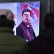 People in a Seoul railway station watch a television news report on the death of Kim Jong-Nam, the half-brother of North Korean leader Kim Jong-Un