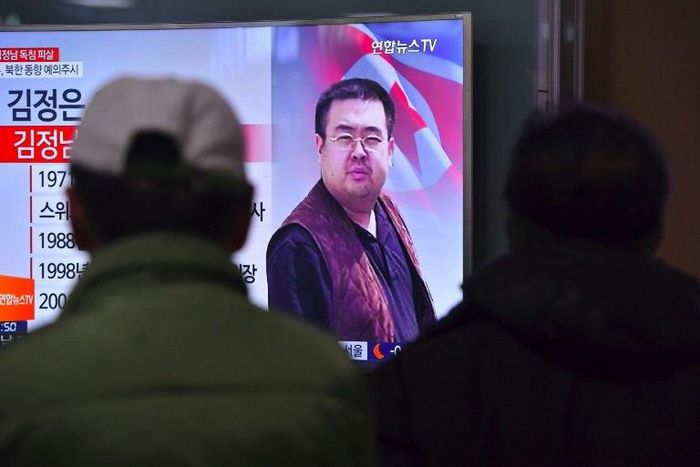 People in a Seoul railway station watch a television news report on the death of Kim Jong-Nam, the half-brother of North Korean leader Kim Jong-Un