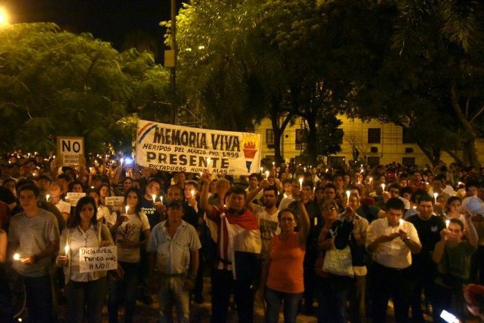 Thousands of demonstrators gather in front of the Congress in Asuncion on April 3, 2017 to rally against a bid to lift a ban on President Horacio Cartes that would allow him to be reelected