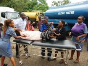 Medics help a girl involved in a past sexual assault incident
