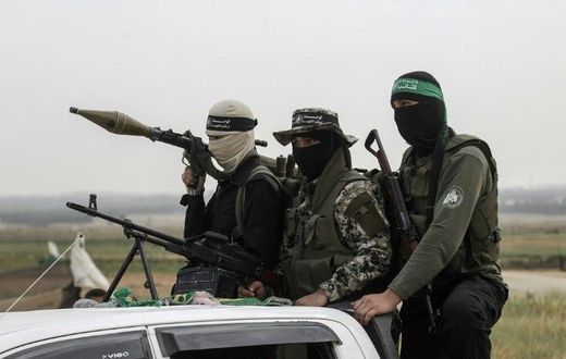 Members of the Ezzedine al-Qassam Brigades, the militant wing of the Palestinian Islamist movement Hamas, patrol in the southern Gaza Strip