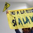 A woman holds a banner reading "No to mining. Yes to life" during a protest against mining at the Legislative Assembly in San Salvador on March 29, 2017
