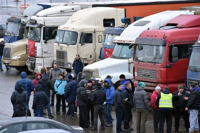 Russian long-distance truck drivers gather at a parking in Khimki, outside Moscow, on December 4, 2015, to protest against the Platon truck taxation system, a system against which truckers have launched a new protest