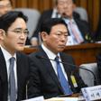 Samsung Group's heir-apparent Lee Jae-Yong (L) answers a question as Lotte Group Chairman Shin Dong-Bin listens during a parliamentary probe into a scandal engulfing President Park Geun-Hye, at the National Assembly in Seoul, on December 6, 2016