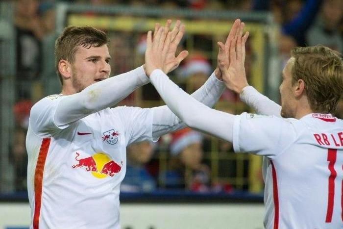 Leipzig's forward Timo Werner (L) celebrates with teammate forward Emil Forsberg after he scored during the German first division Bundesliga football match against SC Freiburg November 25, 2016