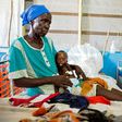 Regina Aluel holds her grandson Agop Manut, 11-months-old, who suffers acute malnutrition and respiratory distress at the clinic run by Doctors Without Borders in Aweil, northern Bahr al-Ghazal, South Sudan in 2016
