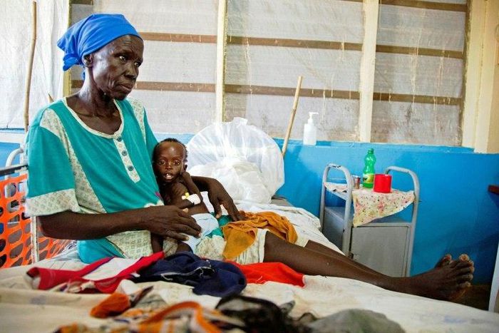 Regina Aluel holds her grandson Agop Manut, 11-months-old, who suffers acute malnutrition and respiratory distress at the clinic run by Doctors Without Borders in Aweil, northern Bahr al-Ghazal, South Sudan in 2016