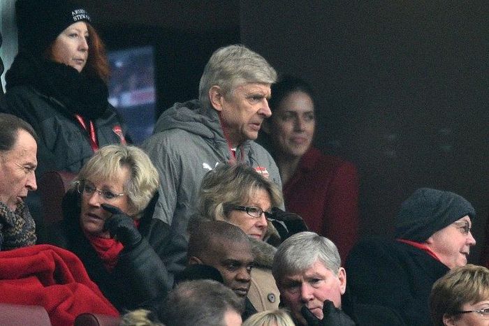 Arsenal's French manager Arsene Wenger (C) takes his seat in the stands for their match against Hull City at the Emirates Stadium in London on February 11, 2017