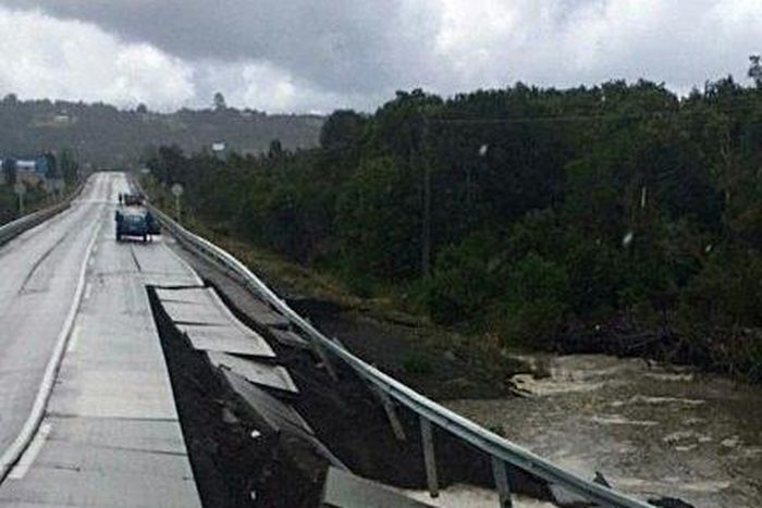 View of a bridge damaged by a 7.7-magnitude earthquake in Castro on Chiloe Island, southern Chile, on December 25, 2016