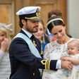 Sweden's Prince Carl Philip (L) and Princess Sofia at the christening of their first child Prince Alexander in September last year