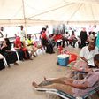 People donating blood at a camp set up by Red Cross during Dusit attack