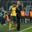 Arsenal's manager Arsene Wenger (R) brings on Arsenal's defender Gabriel during the UEFA Champions League round of sixteen football match against FC Bayern Munich February 15, 2017