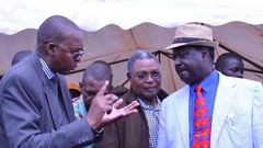 Taita Taveta governor John Mruttu explains a point to Cord leader Raila Odinga as Wundanyi MP Thomas Mwadeghu.