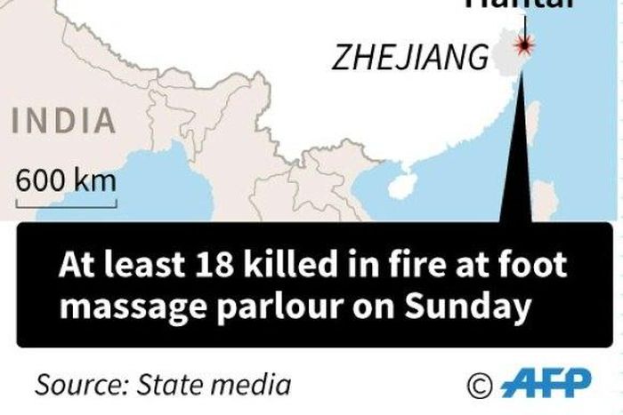 The area where a fire at a massage parlour killed at least 18 people on Sunday