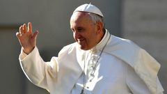 Pope Francis salutes people upon arrival in St. Peter's square at the Vatican for his weekly general audience on March 29, 2017