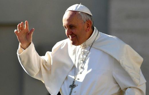Pope Francis salutes people upon arrival in St. Peter's square at the Vatican for his weekly general audience on March 29, 2017