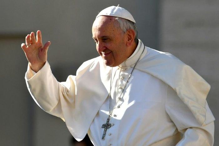 Pope Francis salutes people upon arrival in St. Peter's square at the Vatican for his weekly general audience on March 29, 2017