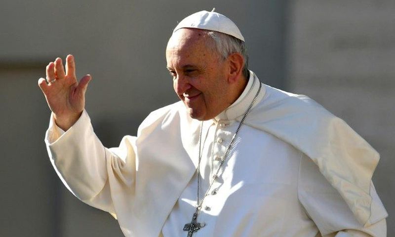 Pope Francis salutes people upon arrival in St. Peter's square at the Vatican for his weekly general audience on March 29, 2017
