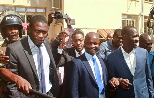 Kenya Medical Practitioners and Dentists Union's (KPMDU) Secretary General, Dr Ouma Oluga (L), Chairman Dr Samuel Oroko (C) and Dr Allan Ochanji (R) are led away in handcuffs in Nairobi on February 13, 2017