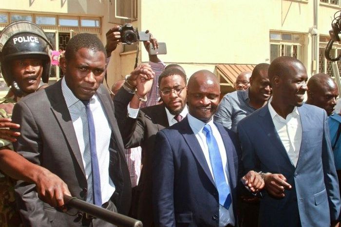 Kenya Medical Practitioners and Dentists Union's (KPMDU) Secretary General, Dr Ouma Oluga (L), Chairman Dr Samuel Oroko (C) and Dr Allan Ochanji (R) are led away in handcuffs in Nairobi on February 13, 2017