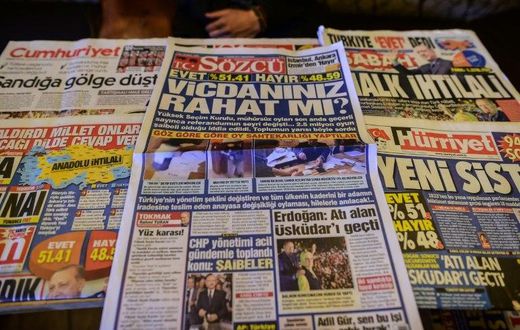 Turkish authorities have reportedly issued arrest warrants for the owner and three employees of opposition daily Sozcu seen displayed with other papers on an Istanbul newsstand