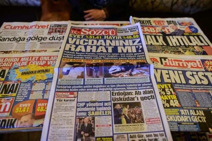 Turkish authorities have reportedly issued arrest warrants for the owner and three employees of opposition daily Sozcu seen displayed with other papers on an Istanbul newsstand