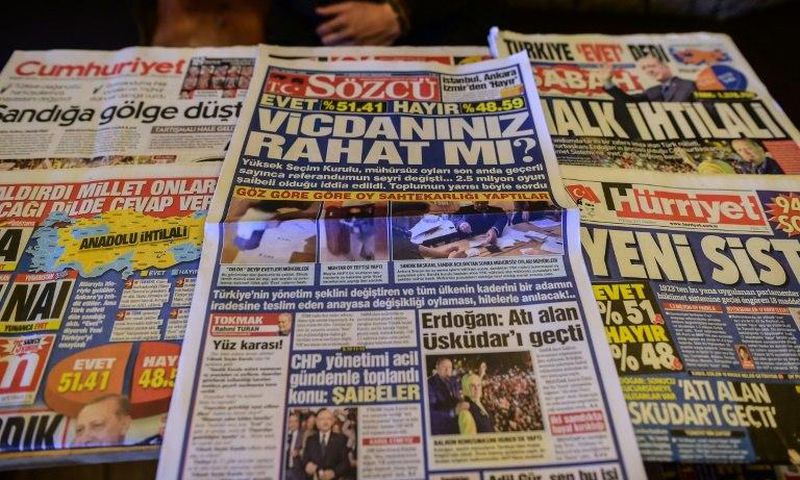 Turkish authorities have reportedly issued arrest warrants for the owner and three employees of opposition daily Sozcu seen displayed with other papers on an Istanbul newsstand